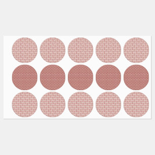 Red and pink textiles laid over a patterned rug wi