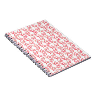 Red and pink wrapping paper featuring a repeating  notebook