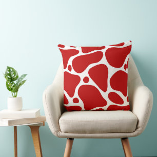 Red and white abstract giraffe pattern cushion