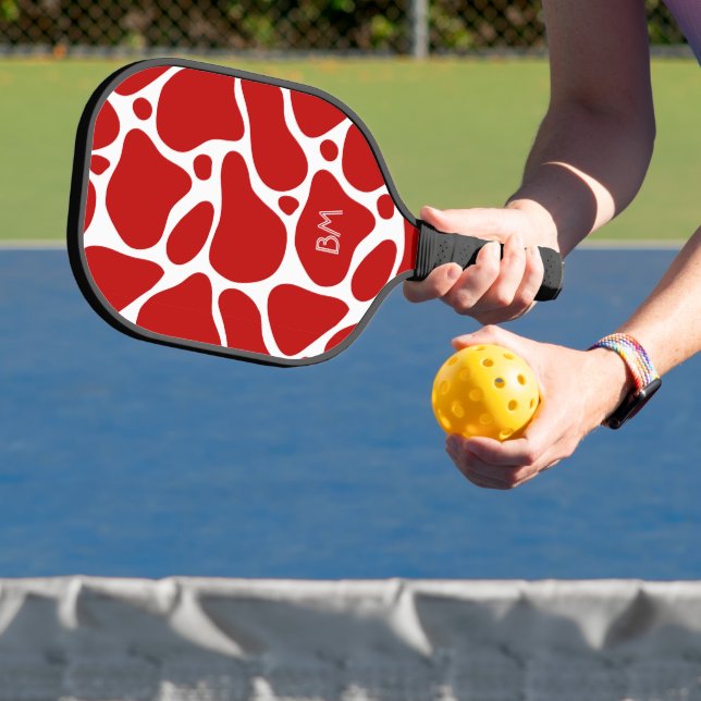 Red  and white abstract giraffe pattern pickleball paddle (Insitu)