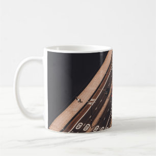 RED AND WHITE BUS RUNNING ON BRIDGE COFFEE MUG