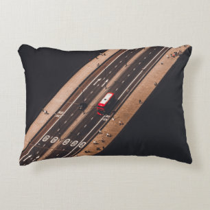 RED AND WHITE BUS RUNNING ON BRIDGE DECORATIVE CUSHION