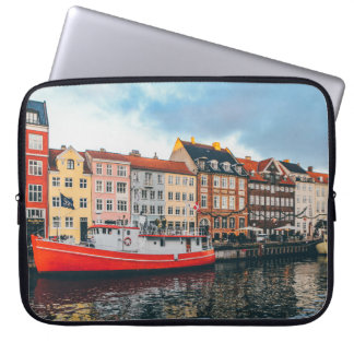 RED AND WHITE CONCRETE BUILDING LAPTOP SLEEVE