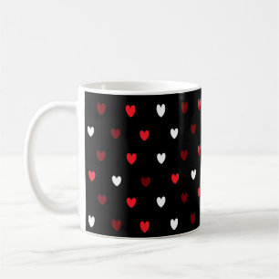 Red and white hearts on black coffee mug