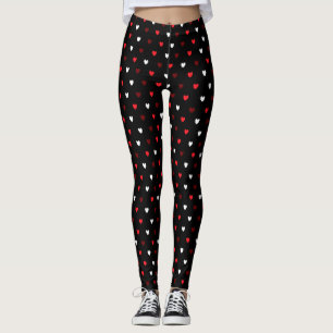 Red and white hearts on black leggings
