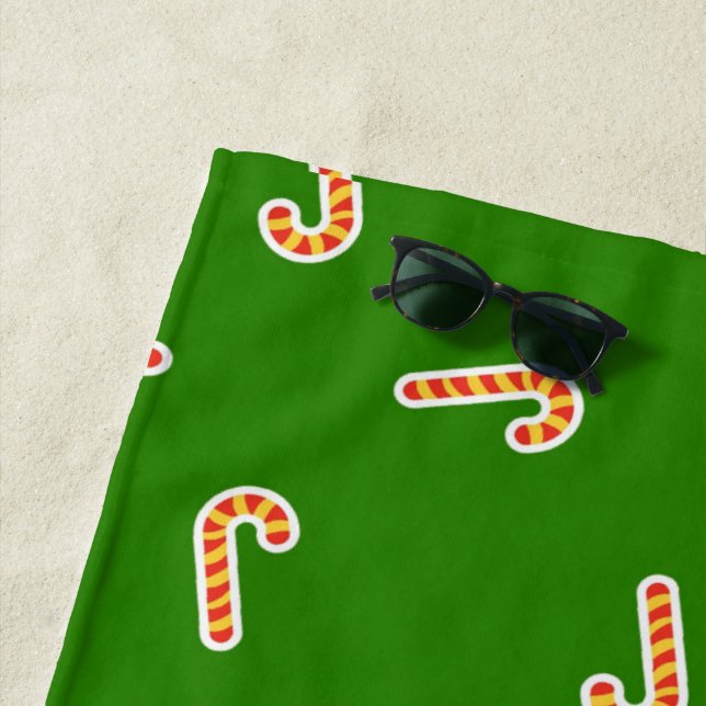 Red and yellow candy canes green beach towel (In Situ)