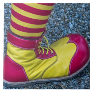 Red and yellow clown shoe ceramic tile