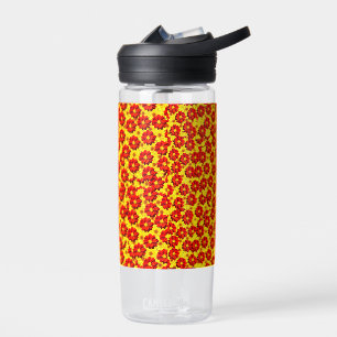 Red and yellow dahlia flowers  water bottle