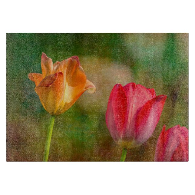 Red and yellow tulips on textured background cutting board (Front)