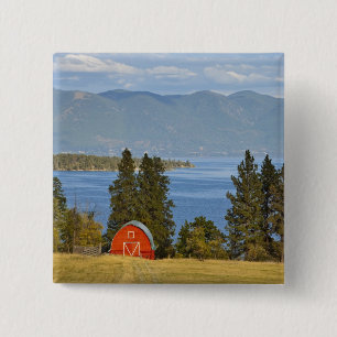 Red barn sits along scenic Flathead Lake near 15 Cm Square Badge