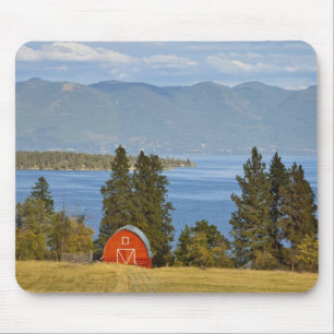 Red barn sits along scenic Flathead Lake near Mouse Mat