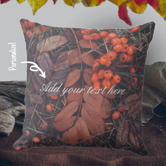 Red berries and brown autumn leaves cushion