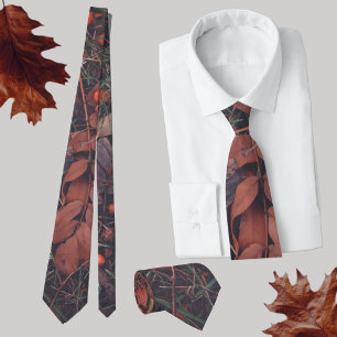 Red berries and brown autumn leaves tie