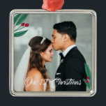 Red Berries - Our First Christmas - Wedding Photo Metal Tree Decoration<br><div class="desc">Romantic Christmas ornament celebrating the newly wed's first Christmas as a married couple. Add your own wedding photo. The ornament is decorated with illustrations of leaves and berries in green and red. Our 1st Christmas is written in a modern calligraphy script.</div>
