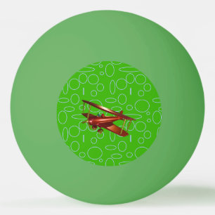 Red Bi-plane on Green Circles and Loops Ping Pong Ball