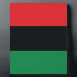 Red, Black and Green Flag Plaque<br><div class="desc">The 3 Pan-African colors on the flag represent: RED: the blood that unites all people of Black African ancestry, and shed for liberation; BLACK: black people whose existence as a nation, though not a nation-state, is affirmed by the existence of the flag; and GREEN: the abundant natural wealth of Africa....</div>
