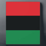 Red, Black and Green Flag Plaque<br><div class="desc">The 3 Pan-African colors on the flag represent: RED: the blood that unites all people of Black African ancestry, and shed for liberation; BLACK: black people whose existence as a nation, though not a nation-state, is affirmed by the existence of the flag; and GREEN: the abundant natural wealth of Africa....</div>