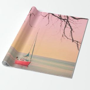 RED BOAT ON BEACH DURING SUNSET WRAPPING PAPER
