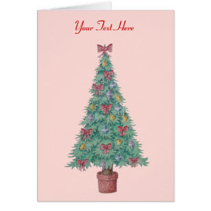 red bows and bells on decorated tree for christmas