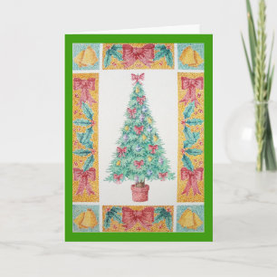red bows and bells on decorated tree for christmas holiday card