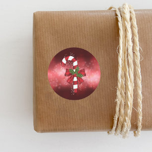 Red Candy Cane On A Red Bokeh Background Classic Round Sticker