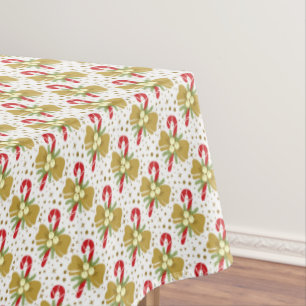 Red Candy Canes Gold Ribbons on White Christmas Tablecloth