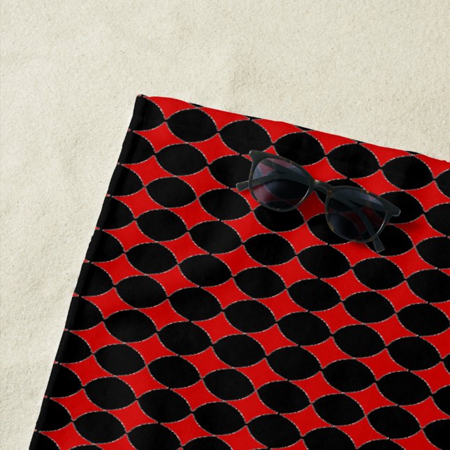 Red card diamonds on black beach towel (In Situ)