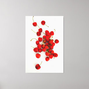 Red Cherries in Natural Light Lay on White Canvas Print