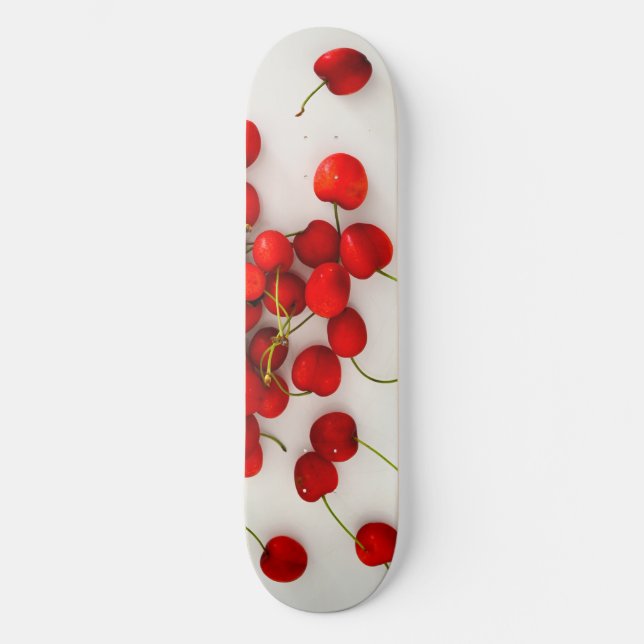 Red Cherries in Natural Light Lay on White Skateboard (Front)