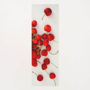 Red Cherries in Natural Light Lay on White Yoga Mat