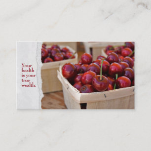 red cherries in produce box business card