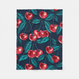 Red cherries on dark blue fleece blanket