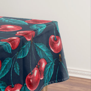 Red cherries on dark blue tablecloth