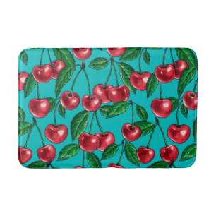 Red cherries on turquoise bath mat