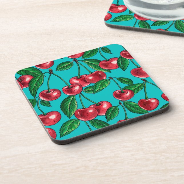 Red cherries on turquoise coaster (Left Side)
