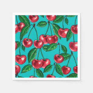 Red cherries on turquoise napkin