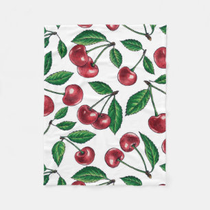 Red cherries on white fleece blanket