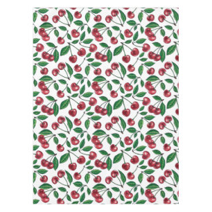 Red cherries on white tablecloth