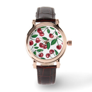 Red cherries on white watch