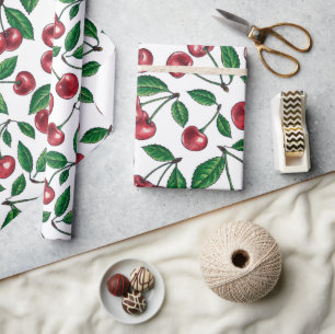 Red cherries on white wrapping paper