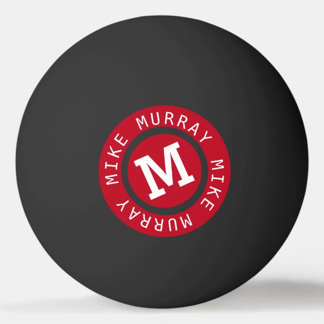 red circle monogram on black ping pong ball (Front)