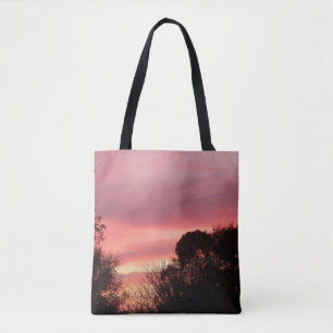 Red Clouds at sunrise on an all over print tote Bag
