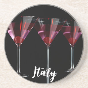 Red cocktails in martini glass with cherry coaster
