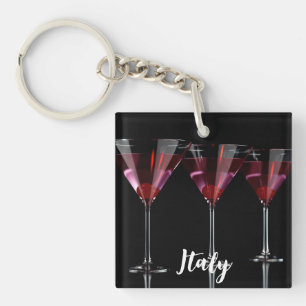 Red cocktails in martini glass with cherry key ring
