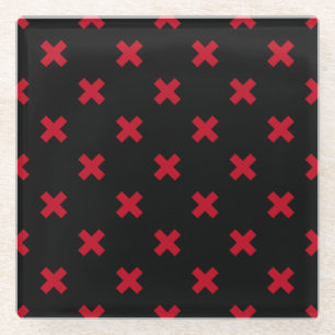 Red cross stitches on black glass coaster