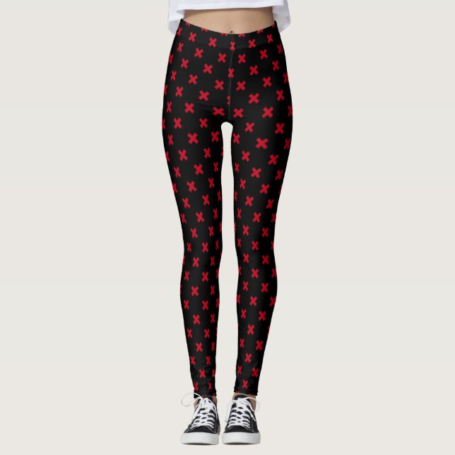 Red cross stitches on black leggings (Front)