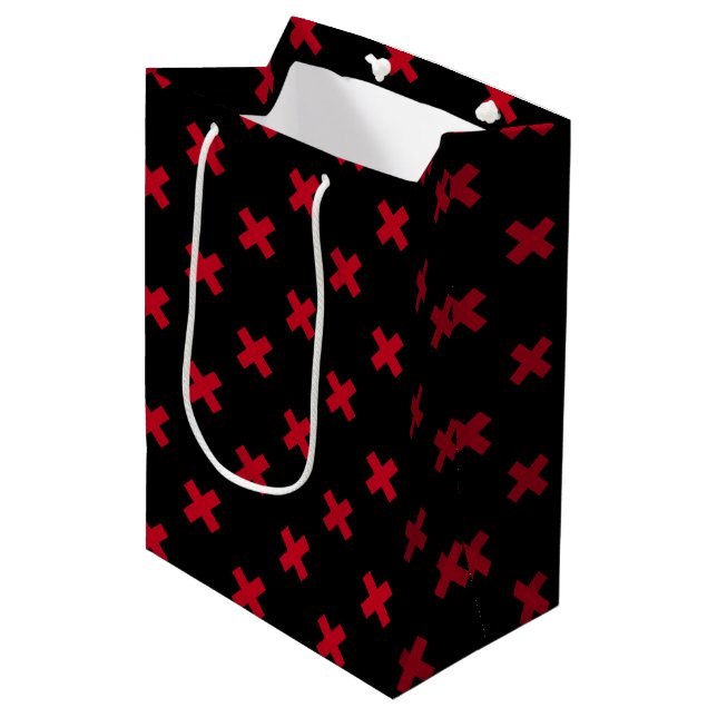 Red cross stitches on black medium gift bag (Front Angled)