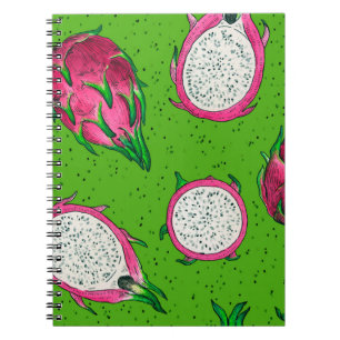 Red dragon fruit on green notebook