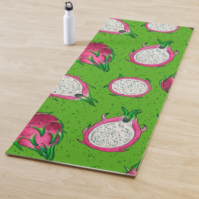 Red dragon fruit on green yoga mat (In Situ)