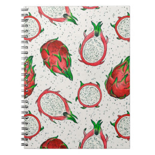 Red dragon fruit on off white notebook
